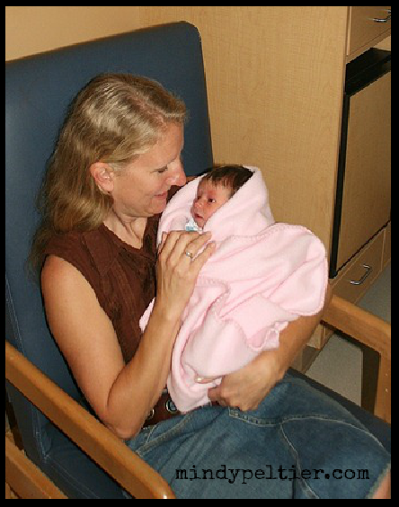 grandmother holding newborn 