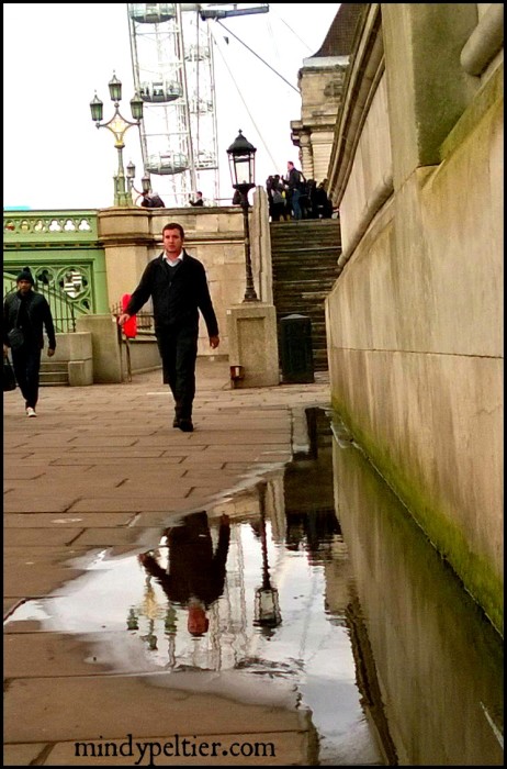 Reflections of a Man in a London puddle. Photo by @MindyJPeltier